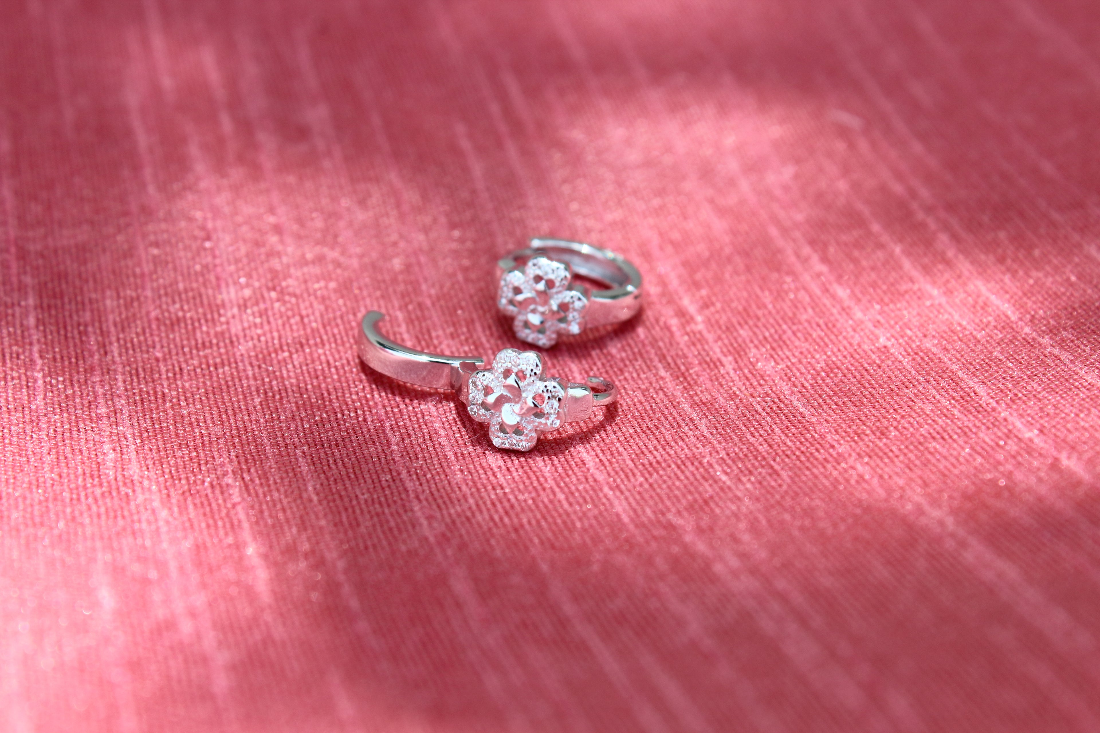Zircon studded flower hoop